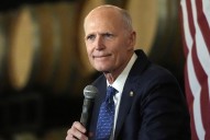 Rick Scott stands against socialism. Maybe he should let Trump know.