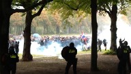 Police fire tear gas at anti-immigration protesters in The Hague