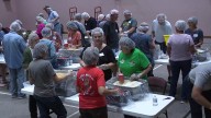 100 volunteers in Columbia County pack 15,000 meals for families in need