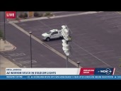 Worker stuck in stadium lights in Mesa, Arizona