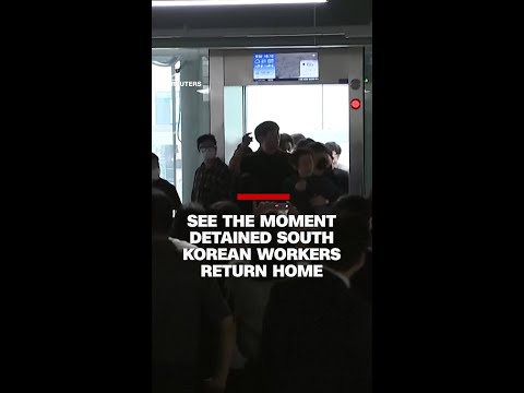See the moment detained South Korean workers return home