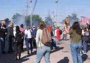 Federal agents fire chemicals as protesters try to block car at immigration site outside Chicago