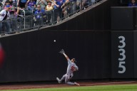 Nationals rookie Daylen Lile exits with knee injury after sliding into the wall against the Mets