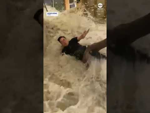 Flood waters crash through hotel doors in Hong Kong