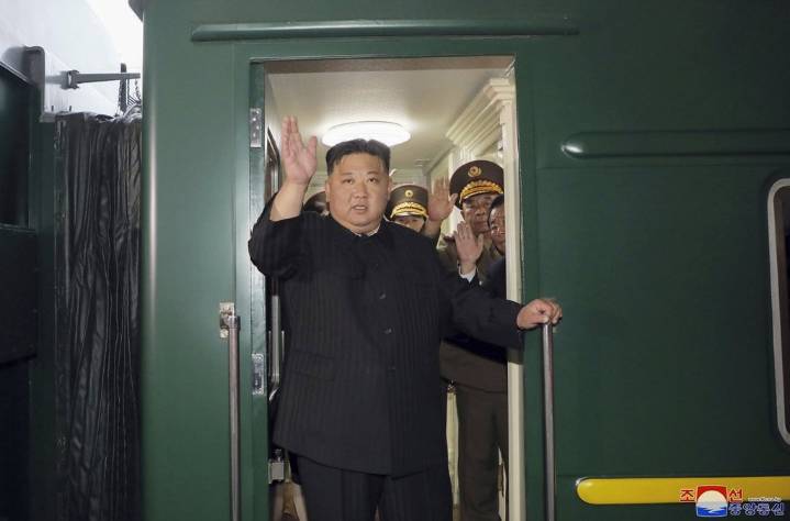 Kim Jong Un rides his trademark green train to China. He also has a plane, limos and white horses