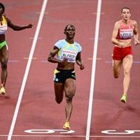 Olympic champion Alfred eases through 100m heats at Tokyo worlds