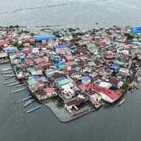 Against the tide: Filipinos battle rising sea on sinking island