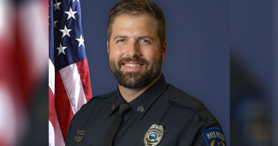 Procession escorts slain police officer home to Hays