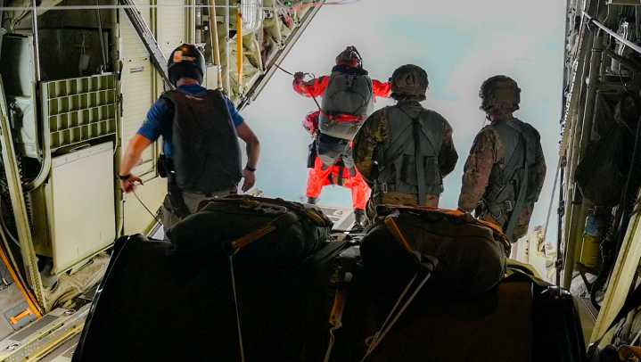 National Guardsmen pararescue team leap onto a freighter at sea to rescue patient