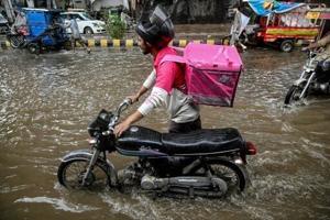 No pause for food delivery riders during Pakistan’s monsoon