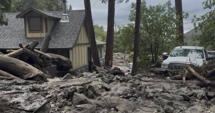 Mudslides trap drivers, bury roads and damage homes in Southern California