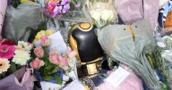 Boxing glove surrounded by flowers outside Ricky Hatton's home following death aged 46