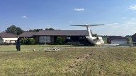 Plane runs off of runway into home at Mayfield airport