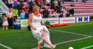 Couple celebrate wedding day at football game – after getting married at crematorium