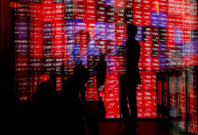 Asia stocks gain, bonds fall as traders judge odds of bigger Fed cut
