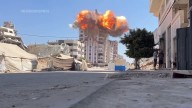 Israel’s military destroys multiple buildings in Gaza City, after warning residents to leave