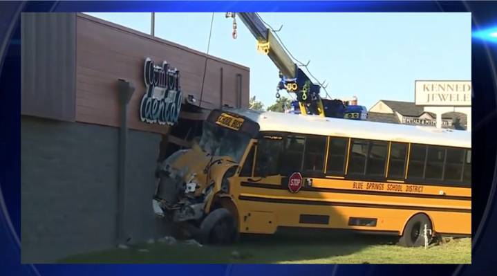 Four taken to hospital after school bus slams into building Thursday morning