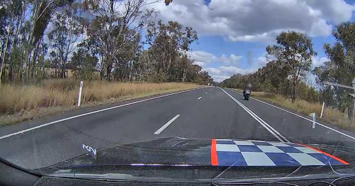 Dashcam footage shows motorcyclist being caught doing 'phenomenal speed' in Southern Downs