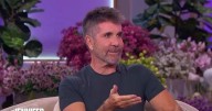 Simon Cowell baffles fans with his 'awkward' clapping as he graces the iconic 'spirit tunnel'