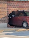 SUV crashes through historic mid