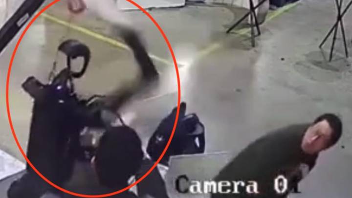 Haunting moment robot attacks handlers in angry rampage as it tries to break free from restraints in 'dystopian scenes'