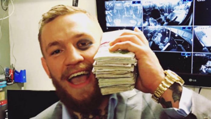 Conor McGregor Nursing Head Wound With Giant Stack Of Money