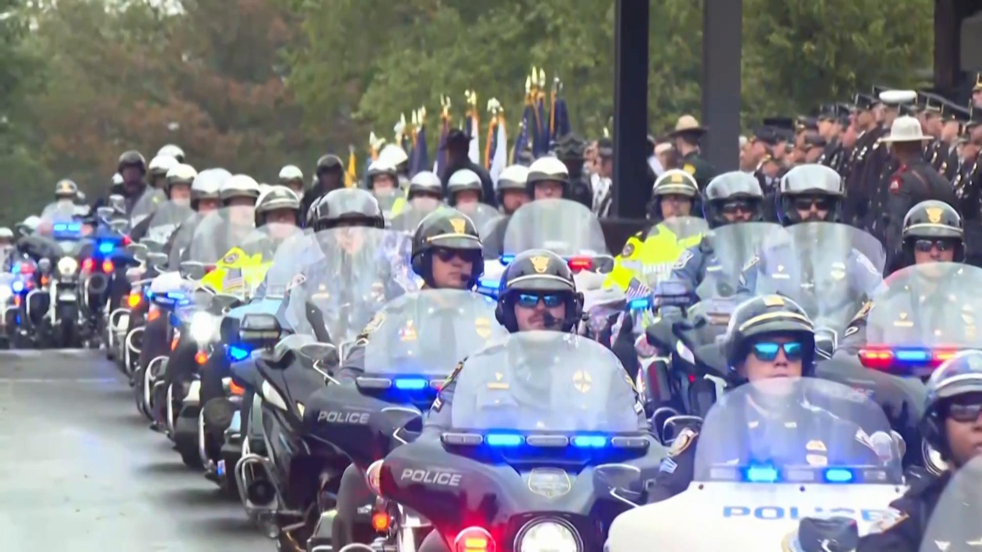 Police gather for the funeral of 3 Pennsylvania detectives ambushed by gunman
