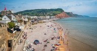 Man, 80, found dead on rocks along popular UK beach after huge rescue operation