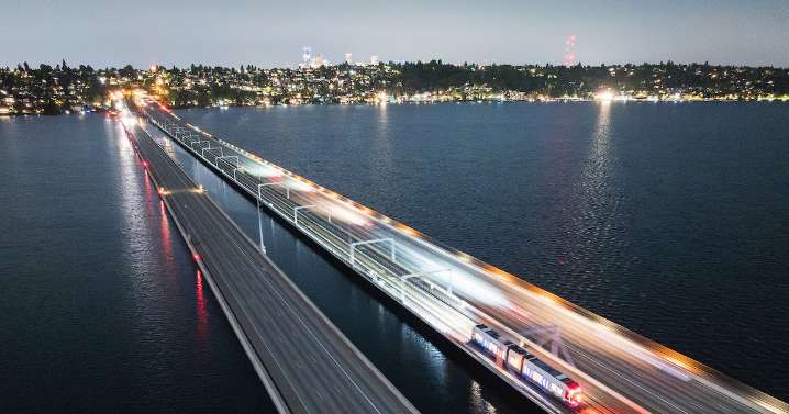 Light rail train crosses Lake Washington under power