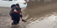 WATCH: Man rescues 2 women trapped in van on flooded Phoenix freeway