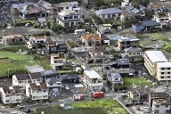 People left with fractured faces after typhoon destroys buildings in Japan
