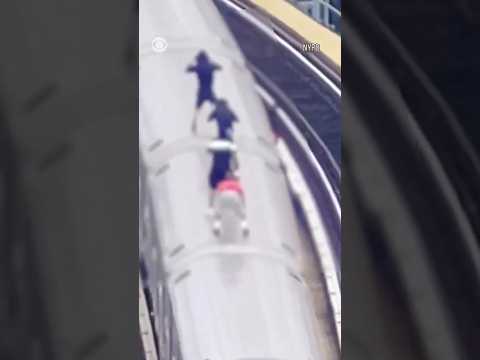Some kids in New York City risk their lives by climbing onto fast