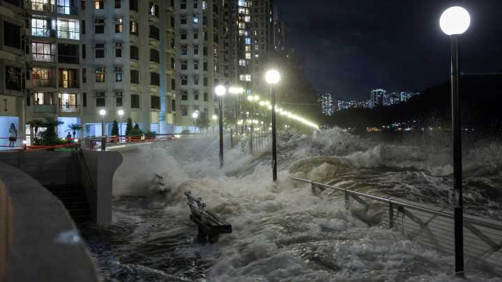 World’s BIGGEST super typhoon this year slams into Hong Kong & washes pair out to sea while lake bursts in Taiwan