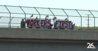 Locals display Labor Day message on highway overpass to promote worker unity