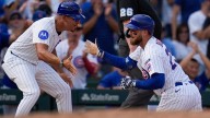 Busch stars as the Cubs beat the Cardinals 7-3 to clinch the top NL wild card