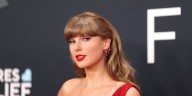 Taylor Swift Hides Behind Barrier at Chiefs Game