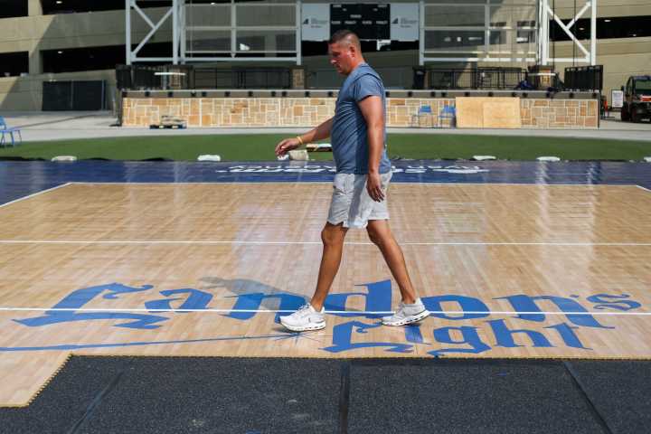 PHOTOS: Preparing the outdoor volleyball court for Tuesday's matches at The Lights