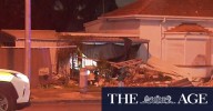 Driver hospitalised after dramatic car crash outside Aderlaide home