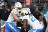 Deadspin | Chargers RB Najee Harris carted off with leg injury vs. Broncos