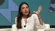 Sacrilege: Ocasio-Cortez Seen Signing Economic Textbooks