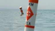 Michigan state park beaches remove swim area buoys for fall season