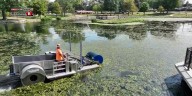 Crews work to clean algae from Capaha Pond