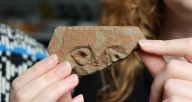 Carved Stone Depicting A Human Face Unearthed In Scotland