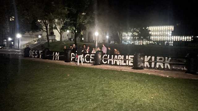 Carnegie Mellon students paint fence in honor of Charlie Kirk