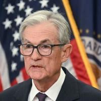 Powell signals Federal Reserve to move slowly on interest rate cuts
