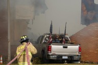 Police remain on scene at burned out Michigan church after shooting and fire leave 4 dead, 8 wounded