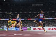 Lyles wins his fourth 200-meter world title. Jefferson-Wooden completes a sprint sweep