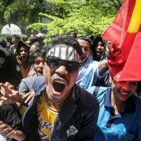 East Timor to scrap MP pensions and SUVs after protests
