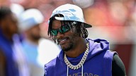 Ravens' Lamar Jackson apologizes for pushing fan who hit his helmet