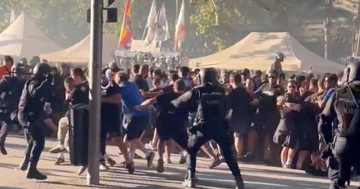 Football fans clash with riot police in ugly scenes ahead of Champions League clash